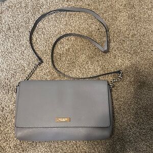 kate spade gray leather crossbody with gold-tone plaque